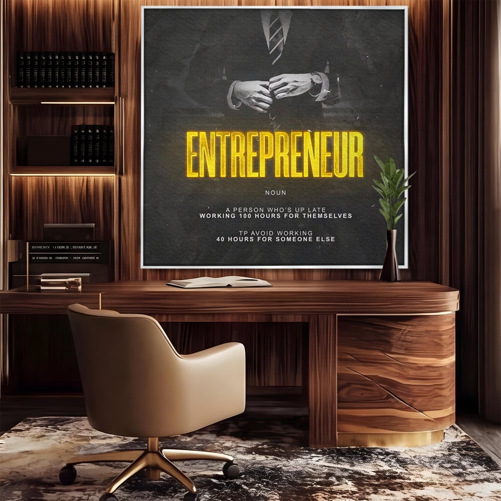Tablou canvas cu ilustratie motivationala cu text si costum, in rama de aluminiu argintiu, pe perete intr-un birou